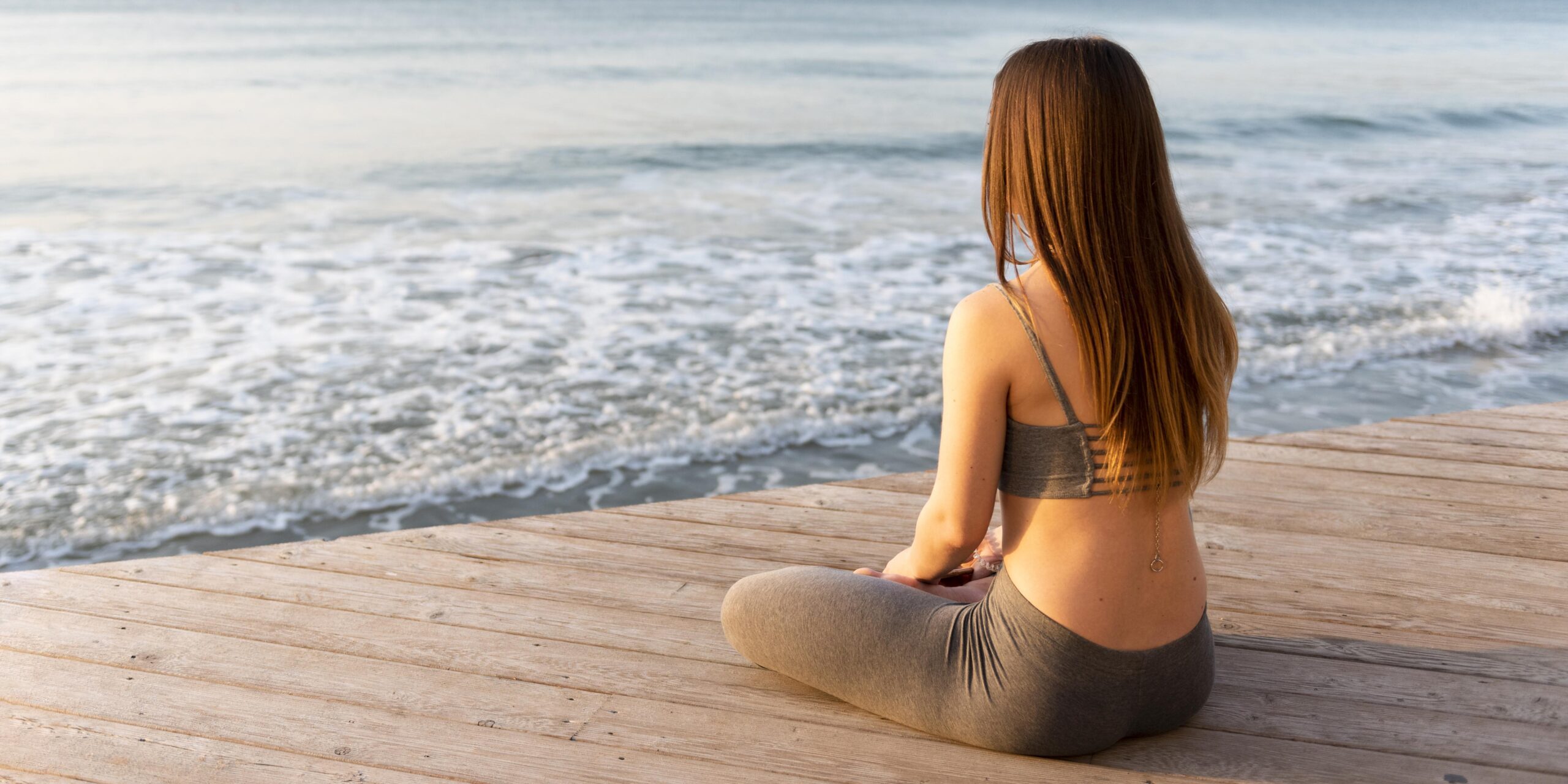 woman-meditating-sea